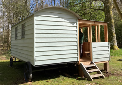 shepherds hut with veranda side view